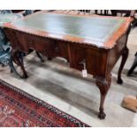 A reproduction George III style mahogany kneehole writing table, width 120cm, depth 58cm, height