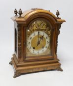A walnut ting tang mantel clock, 34cms high