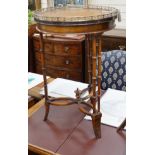 A leather topped mahogany occasional table with brass gallery, diameter 46cm *Please note the sale