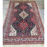 A Caucasian style red ground rug, 214 x 130cm *Please note the sale commences at 9am.