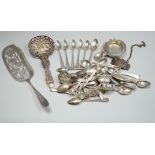 A group of mixed silver and white metal items including flatware, Dutch fish slice, German 800 tea