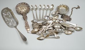 A group of mixed silver and white metal items including flatware, Dutch fish slice, German 800 tea