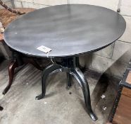A cast iron and painted metal adjustable circular occasional table, width 75cm *Please note the sale