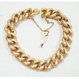An early 20th century 15ct curb link bracelet, with later 9ct gold charm, 17cm, gross weight 26.5