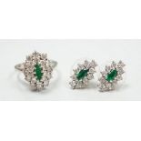 A modern 18ct white gold, emerald and diamond set oval cluster ring, size K/L and a pair of matching