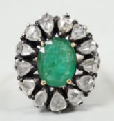An Indian yellow and white metal, emerald and rose cut diamond set oval cluster dress ring, size