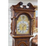 A late Victorian Camerer Cuss & Co carved oak chiming longcase clock, height 237cm *Please note