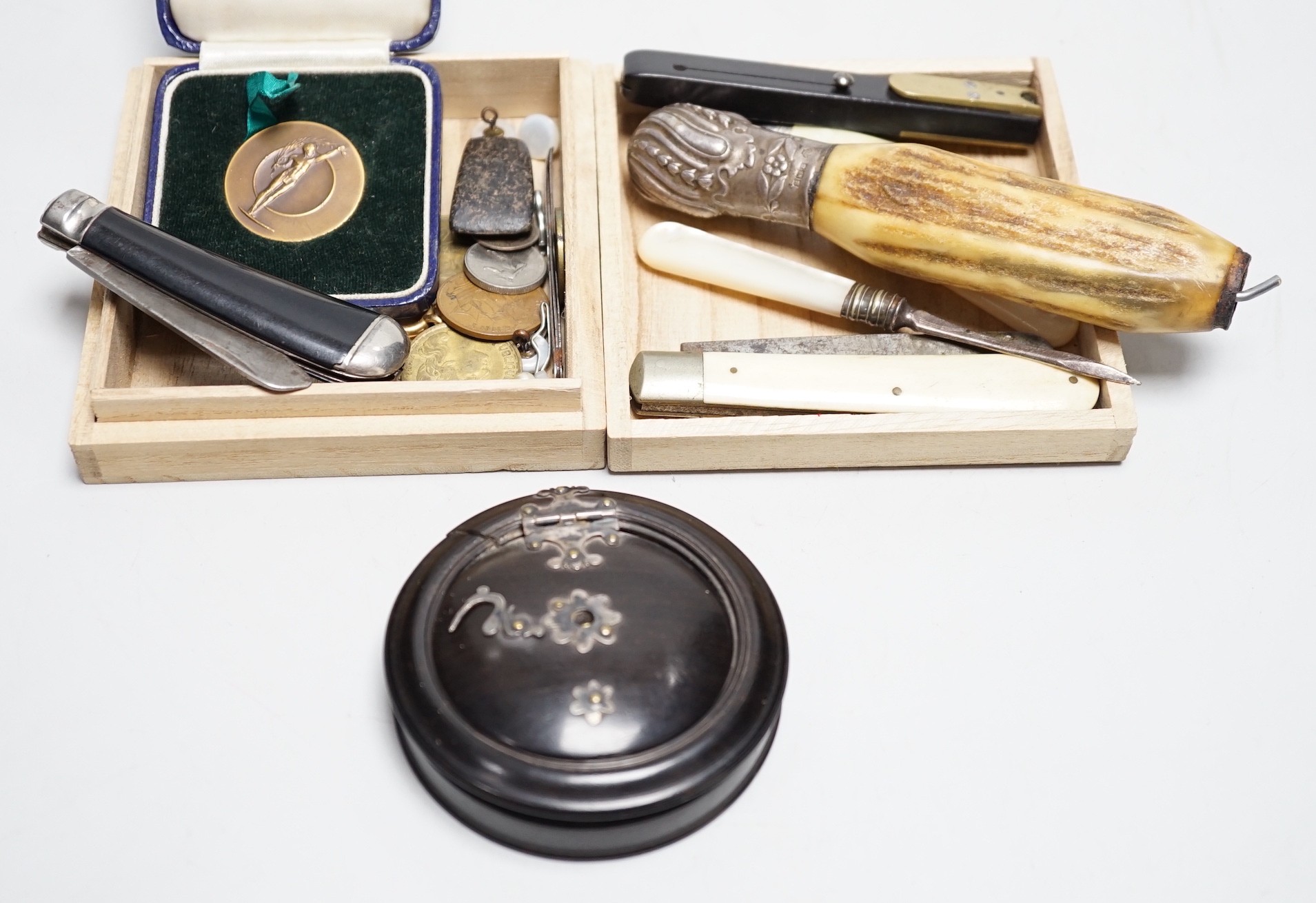 A collection of penknives, coins, a medallion and an unusual concertina box, etc.