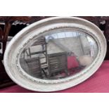 A 1920's white gesso framed oval wall mirror, 84cm *Please note the sale commences at 9am.