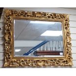 A Florentine giltwood wall mirror, width 98cm, height 77cm *Please note the sale commences at 9am.