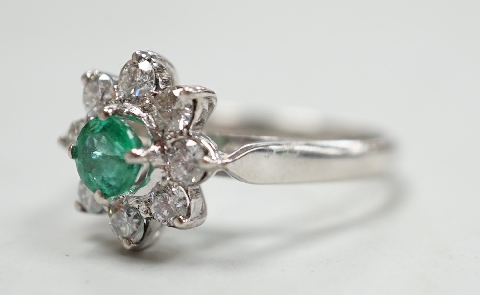 A modern 18k white metal, emerald and diamond set flower head cluster ring, size N, gross weight 4.5 - Image 2 of 2