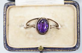 An Edwardian Art Nouveau 9ct and single stone oval cut amethyst set brooch, 31mm, gross weight 2.2