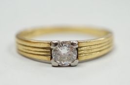 A 1960's 18ct gold and solitaire diamond ring, size M, gross weight 3.6 grams.