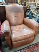 A contemporary tan leather reclining armchair with integral footrest, width 92cm, height 104cm *