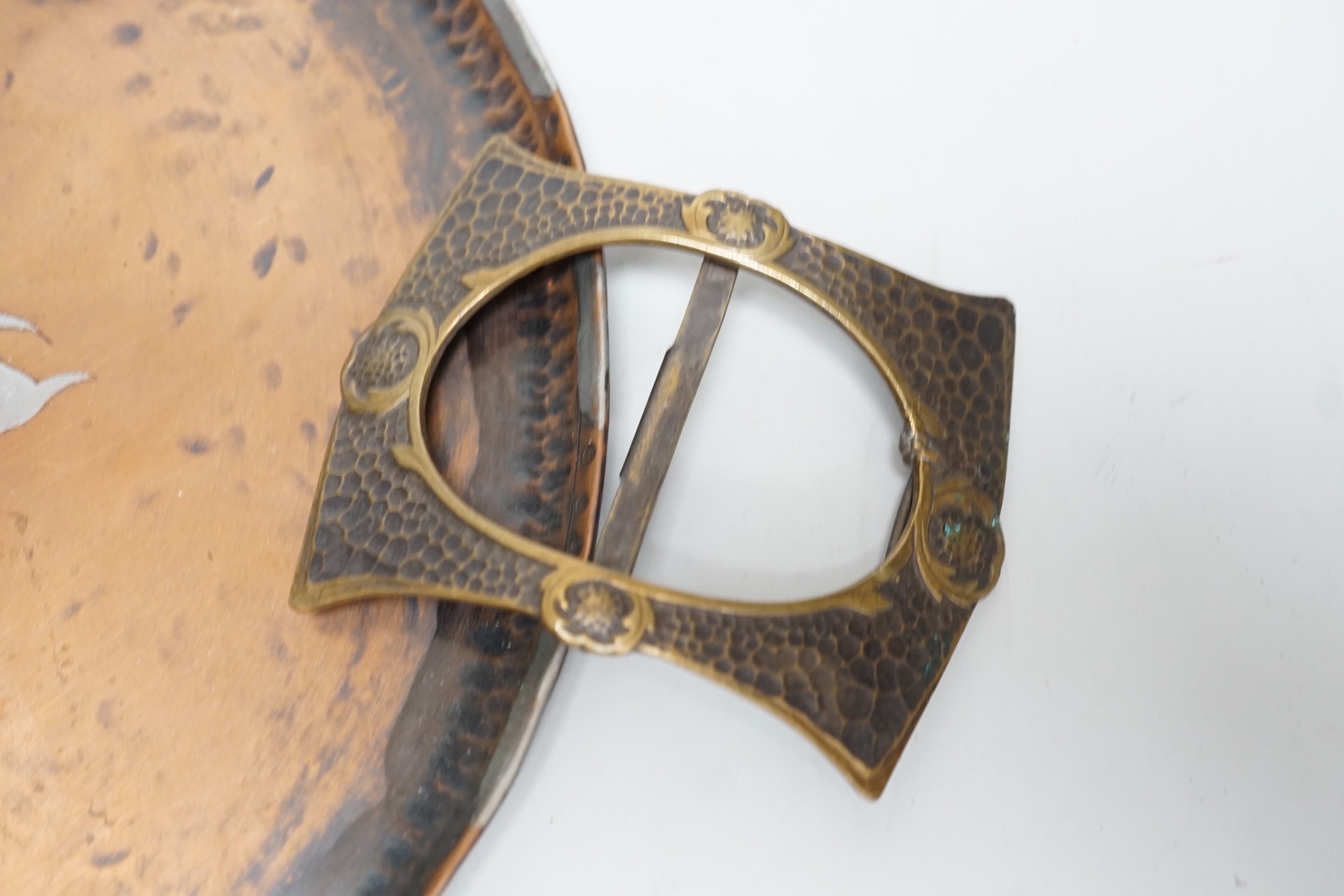 Paul Gillis. An Arts & Crafts copper tray and an Arts & Crafts buckle, tray 28cm diameter - Image 2 of 2