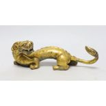 A Chinese gilt bronze figure of a dragon, Han or later, 25cm wide