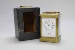 A late 19th century French engraved brass repeating carriage clock with alarm, signed Mottu