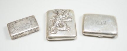 A white metal cigarette case, with applied dragon, 82mm, one other silver cigarette case and a