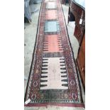 A polychrome flatweave runner, 400 x 75cm *Please note the sale commences at 9am.