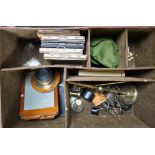 A vintage London Camera Exchange case containing camera plates, lenses etc