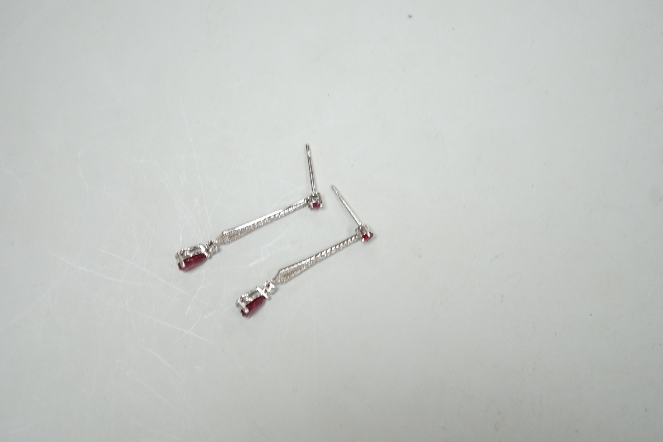 A modern pair of 18k white metal, ruby and diamond cluster set line drop earrings, 30mm, gross - Image 2 of 2