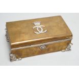 An unusual late Victorian silver mounted brass rectangular cigarette box, with applied monogram,