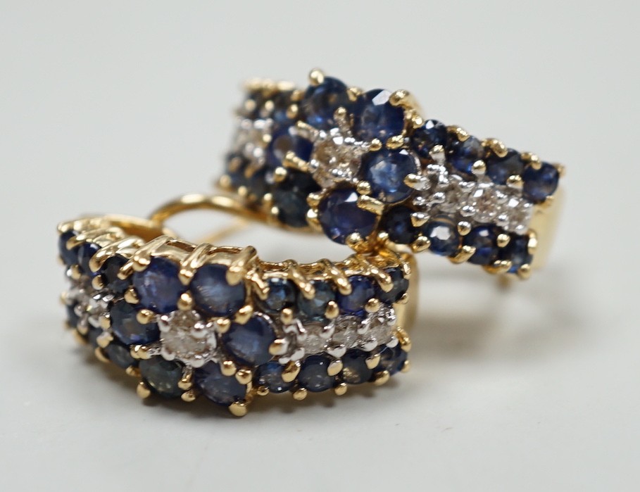 A modern pair of 14k yellow metal, sapphire and diamond cluster set demi-lune earrings, 19mm,