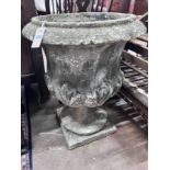 A reconstituted stone garden urn, height 70cm *Please note the sale commences at 9am.