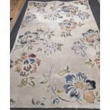 A mid century Indian decorative cream ground carpet, 244 x 154cm *Please note the sale commences
