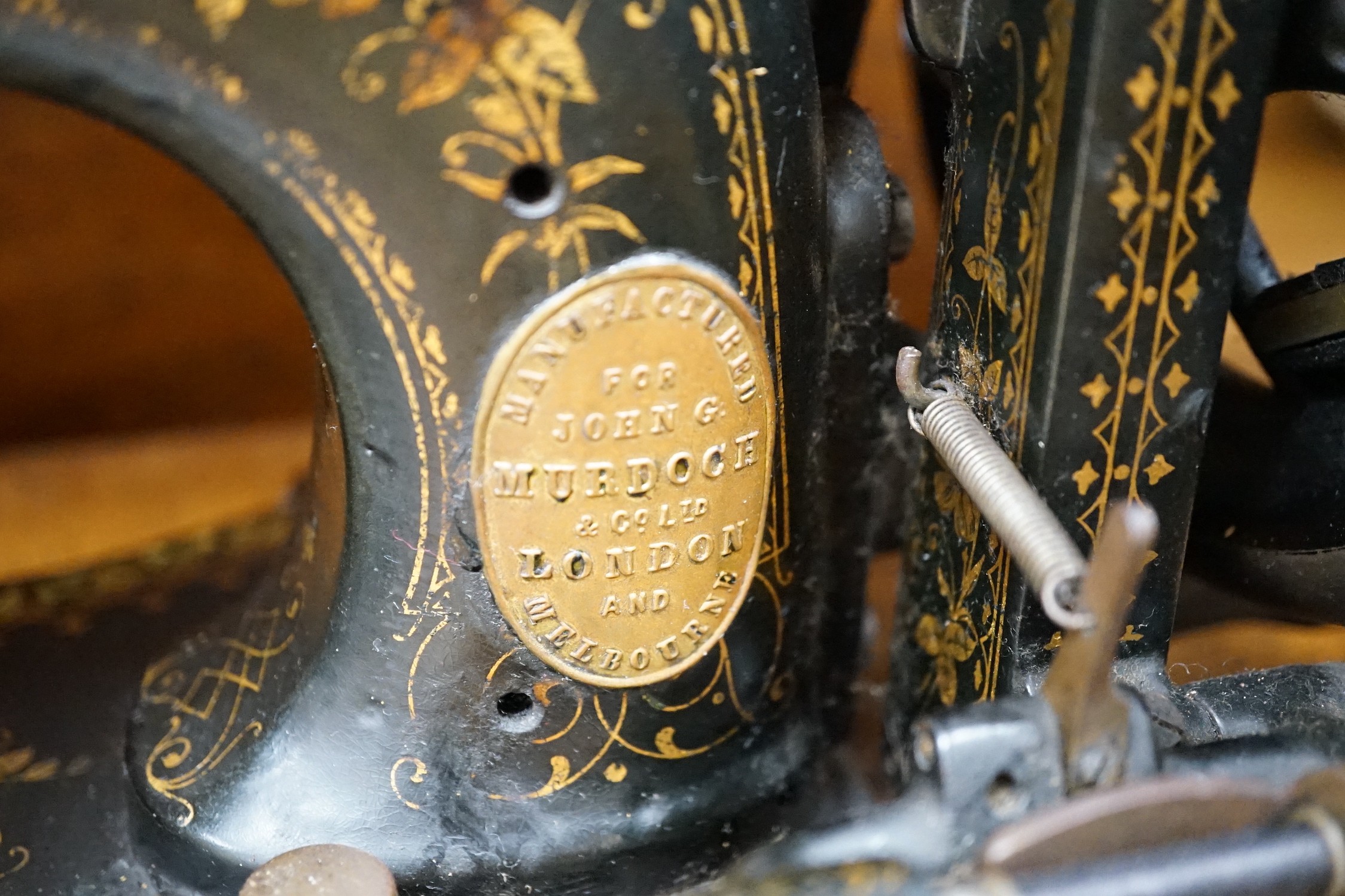 A 19th century mother of pearl decorated John Murdoch sewing machine with wooden case - Image 2 of 2