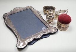 A modern silver mounted photograph frame, 30.2cm, an Edwardian silver mounted pin cushion, mustard