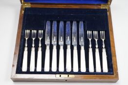 A cased set of six pairs of George V mother of pearl handled silver dessert eaters, Goldsmiths &