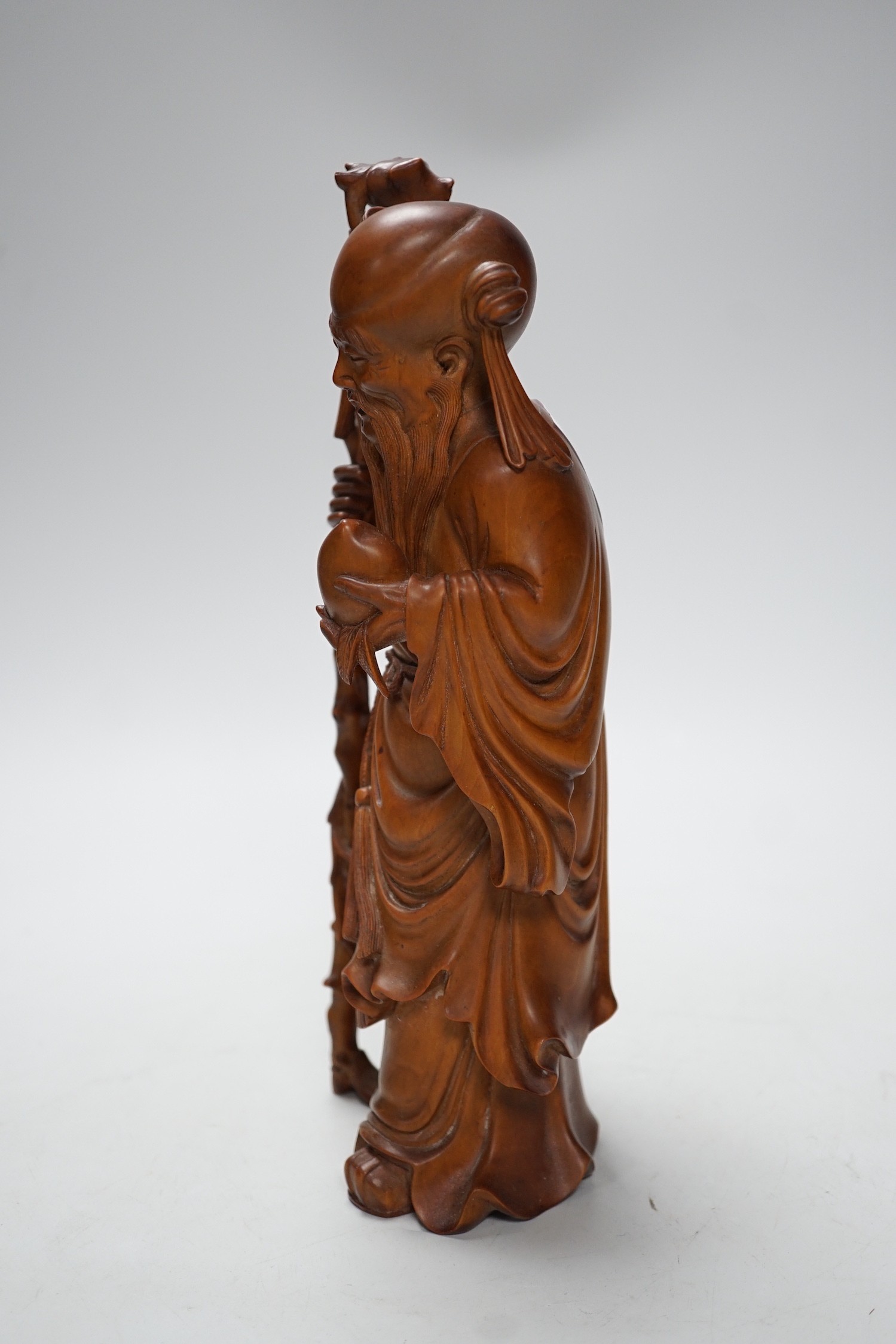 An early 20th century Chinese carved boxwood figure of Shou Lao, 26cm - Image 2 of 2