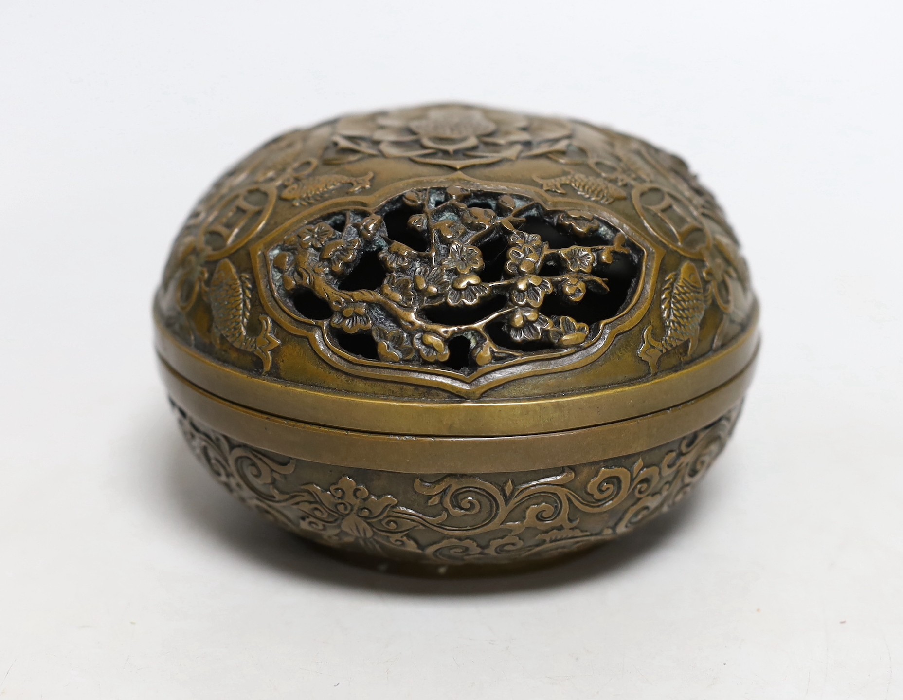 A Chinese circular carved bronze censer, 13.5cm diameter