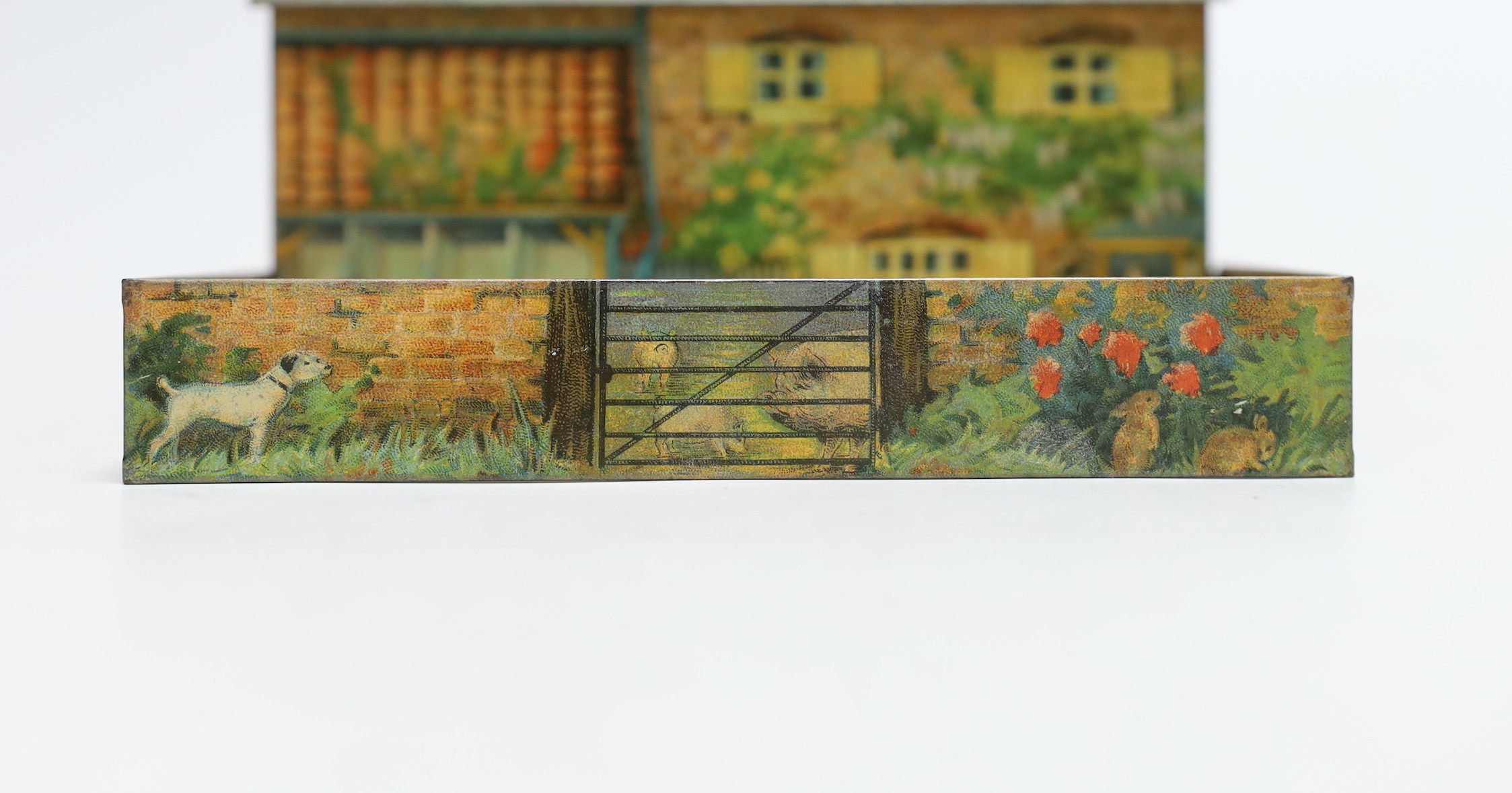 Britains farm series, a Schuco type monkey and a Huntley & Palmers novelty farmhouse biscuit tin, - Image 2 of 2