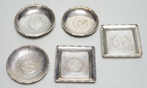 Five white metal ‘coin’ dishes, including one Chinese by Wai Kee, 85mm.