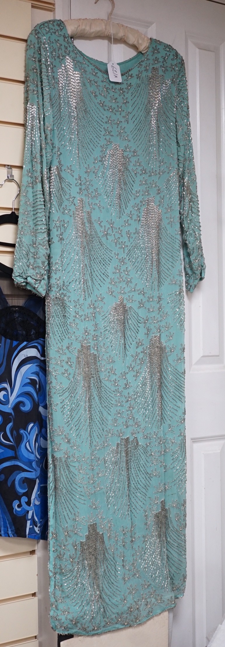 A 1940's turquoise chiffon evening dress and peacock designed shawl owned by Princess Sevilla