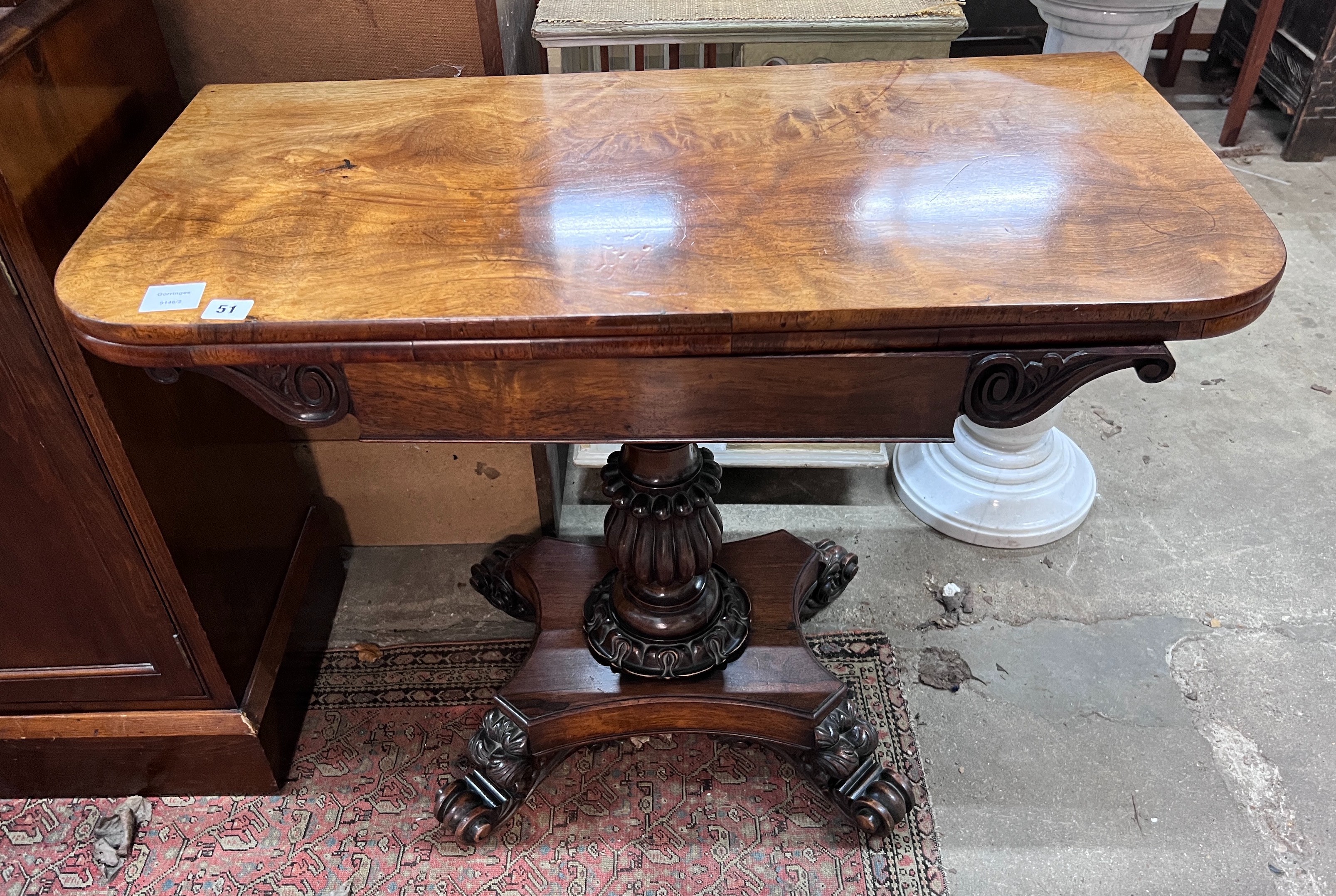 An early Victorian rectangular rosewood folding tea table, width 91cm, depth 45cm, height 72cm *