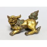 A Chinese gilt bronze figure of a lion dog, Han or later, 13cm wide