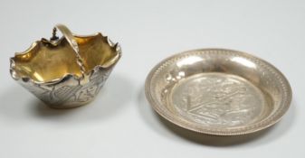A late Victorian novelty parcel gilt silver salt modelled as a basket, with aesthetic engraved