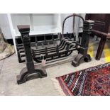 A cast iron fire grate, length 61cm, depth 33cm and a pair of fire dogs *Please note the sale