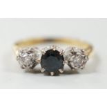 A modern 18ct gold, single stone sapphire and two stone illusion set diamond ring, size N, gross