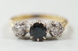 A modern 18ct gold, single stone sapphire and two stone illusion set diamond ring, size N, gross