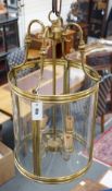 A four light brass hall lantern, 62cm tall