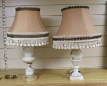 Two alabaster table lamps, 32cms high not including shades and fittings