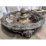 A reconstituted stone garden fountain with associated pedestal, width 76cm *Please note the sale