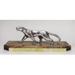 A French Art Deco silvered bronze ‘panther’ by Decoux, on marble base 38cm long