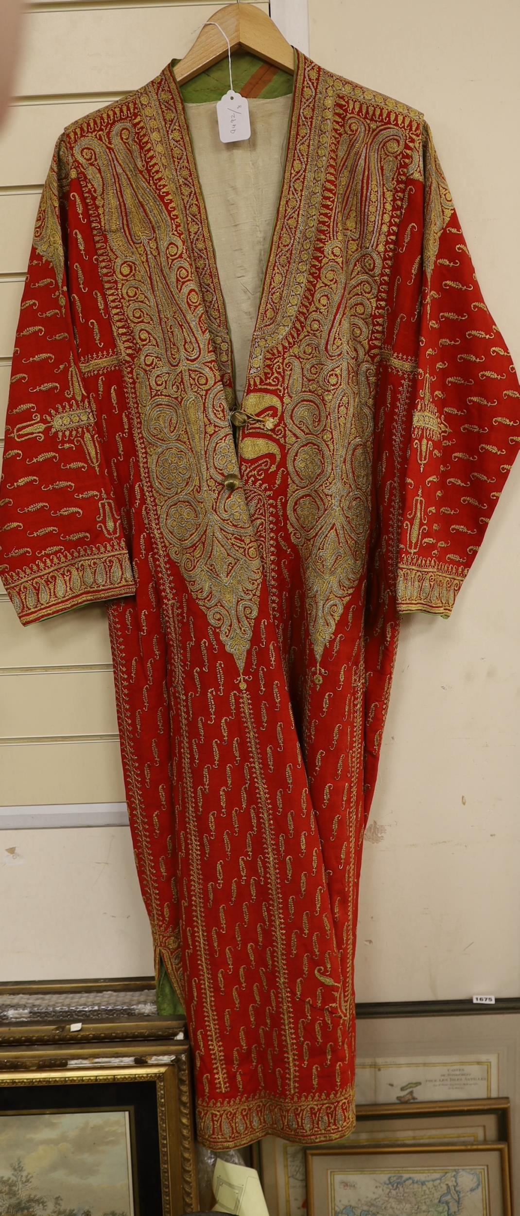 A 19th century fine wool coat, embroidered with gold and silver coloured metal threads in an all