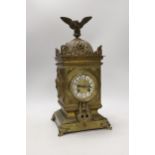 A French brass eagle mounted mantel clock, with ornate dial, 41cm high