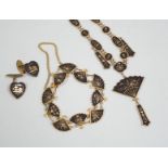 A Japanese gilt damascened iron work suite of jewellery: necklace, bracelet and a pair of cuff